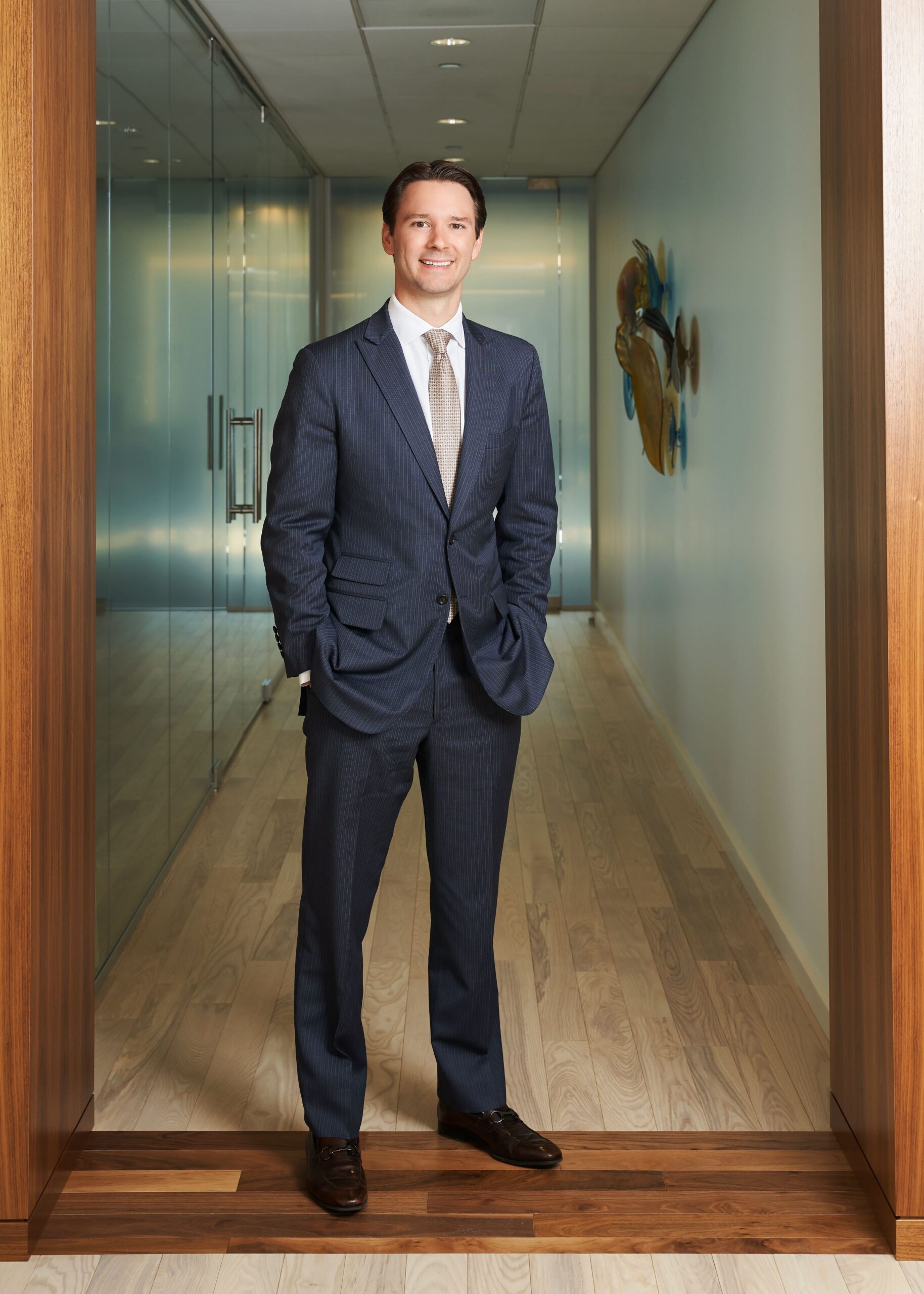 Patrick A. Salvi II standing in hallway of the Chicago office